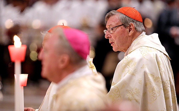FILE PHOTO - Australian Cardinal George Pell holds a candle as Pope Francis leads the Easter vigil mass in Saint Peter's Basilica at the Vatican, April 15, 2017. REUTERS/Max Rossi/File Photo ORG XMIT: SRE405