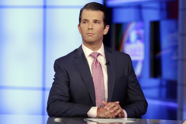 Donald Trump Jr. is interviewed by host Sean Hannity on his Fox News Channel television program, in New York Tuesday, July 11, 2017. Donald Trump Jr. eagerly accepted help from what was described to him as a Russian government effort to aid his father's campaign with damaging information about Hillary Clinton, according to emails he released publicly on Tuesday. (AP Photo/Richard Drew) ORG XMIT: NYRD120