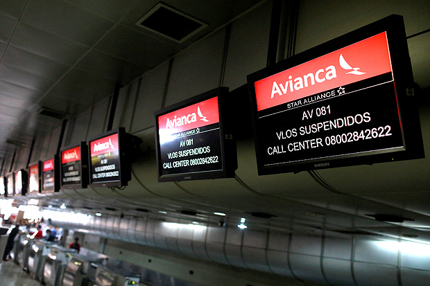Screens hang above counters of Avianca airline, at the Simon Bolivar airport in Caracas, Venezuela July 27, 2017. The screens read 
