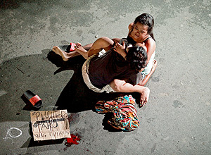 ATTENTION EDITORS - VISUAL COVERAGE OF SCENES OF INJURY OR DEATH Jennilyn Olayres, 26, weeps over the body of her partner, who was killed on a street in Pasay city, Metro Manila, Philippines July 23, 2016. Czar Dancel: 'When the image of Olayres weeping as she cradled the body of her slain partner went viral in the Philippines, President Rodrigo Duterte called it melodramatic. He mentioned the image of Olayres in his state of the union address and said media had tried to portray it as being like the Michelangelo's Pieta, the sculpture of Mary holding the body of Jesus. Six were assassinated on that night in Manila, among them Michael Siaron, Olayres's 29-year-old partner, who was shot dead by unknown assailants on motorcycles. Over recent months I have been regularly covering the killings of suspected drug dealers. During the night journalists and photographers from different media organisations work as a team. Siaron's was the last of several deaths we covered that night. It is always shocking to arrive at the scene of a death. I took a couple of images before I noticed Olayres cradling Siaron's body. A piece of cardboard was left next to his corpse with the word 