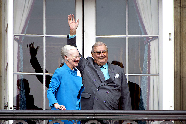 FILE PHOTO: Denmark's Queen Margrethe and Prince Henrik wave from the balcony during Queen Margrethe's 76th birthday celebration at Amalienborg Palace in Copenhagen, Denmark April 16, 2016. REUTERS/Marie Hald/Scanpix/File Photo ATTENTION EDITORS - THIS IMAGE WAS PROVIDED BY A THIRD PARTY. FOR EDITORIAL USE ONLY. NOT FOR SALE FOR MARKETING OR ADVERTISING CAMPAIGNS. THIS PICTURE IS DISTRIBUTED EXACTLY AS RECEIVED BY REUTERS, AS A SERVICE TO CLIENTS. DENMARK OUT. NO COMMERCIAL OR EDITORIAL SALES IN DENMARK. NO COMMERCIAL SALES. ORG XMIT: HFS-INK01