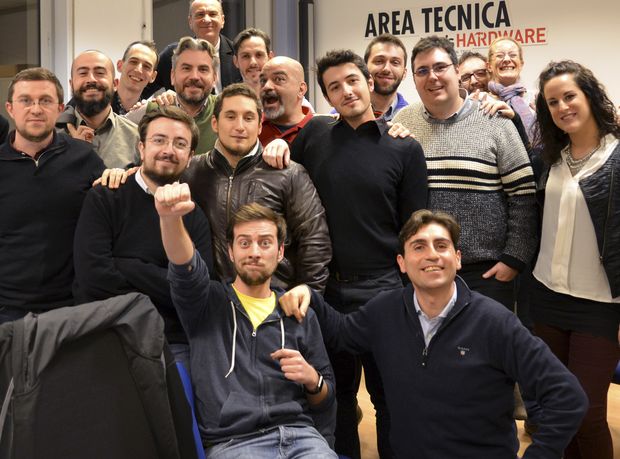 This December 2016 photo provided Friday, Aug. 18, 2017 by Tom's Hardware Italy shows Bruno Gulotta, at center wearing a black shirt, with his colleagues at their office in Legnano, near Milan, Italy. Gulotta is one of the 14 victims of Thursday's deadly van attack in Barcelona. (Tom's Hardware Italy via AP) ORG XMIT: ROM112