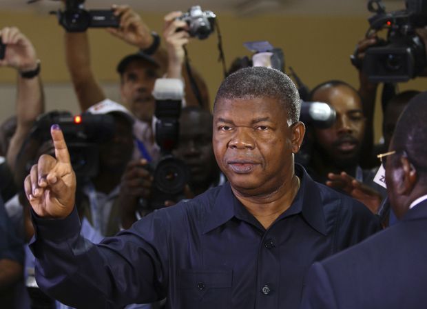 Angola's MPLA main ruling party candidate and defence minister, Joao Lourenco, shows his ink-stained finger after casting his vote in Luanda, Angola, Wednesday, Aug. 23, 2017. Lourenco is the front-runner to succeed President Jose Eduardo dos Santos, who will step down after 38-years in power in an oil-rich country. (AP Photo/Bruno Fonseca) ORG XMIT: XDF101