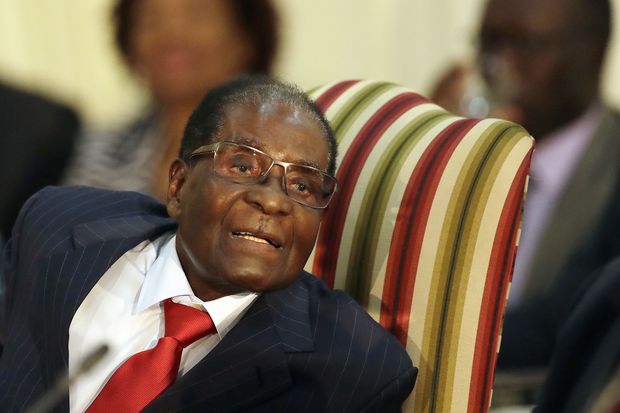 FILE - In this file photo dated Tuesday, Oct. 3, 2017, Zimbabwe's President Robert Mugabe, during his meeting with South African President Jacob Zuma, at the Presidential Guesthouse in Pretoria, South Africa. Zimbabwe President Robert Mugabe has long faced United States sanctions over his government's human rights abuses, but the World Health Organization new director-general Tedros Ghebreyesus is making the longtime African leader a "goodwill ambassador" Friday Oct. 20, 2017.(AP Photo/Themba Hadebe) ORG XMIT: LON109