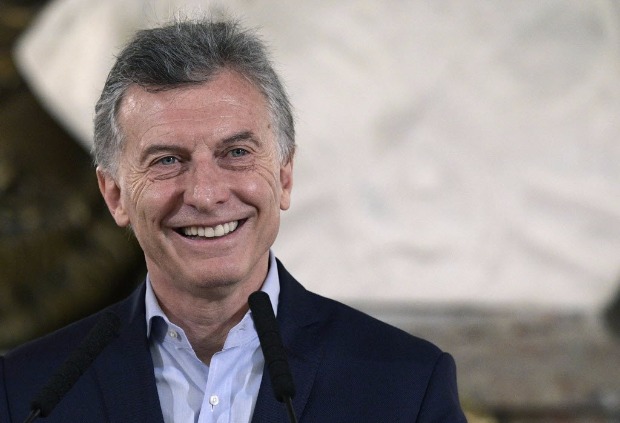 Argentine President Mauricio Macri smiles during a press conference at Casa Rosada presidential palace in Buenos Aires on October 23, 2017 in the aftermath of national legislative elections. Argentina's President Mauricio Macri's center-right coalition swept crucial midterm elections Sunday and emerged with a strengthened hand to carry through pro-market economic reforms. Macri's Cambiemos, or "Let's Change," won in 13 of Argentina's 23 provinces, as well as in the capital Buenos Aires, according to almost completed counts early Monday. / AFP PHOTO / JUAN MABROMATA ORG XMIT: MAB2175