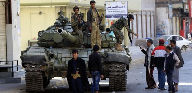 Huthi rebel fighters are seen riding a tank outside of the residence of Yemen's former President Ali Abdullah Saleh in Sanaa on December 4, 2017. Yemen's rebel-controlled interior ministry announced on December 4 the 
