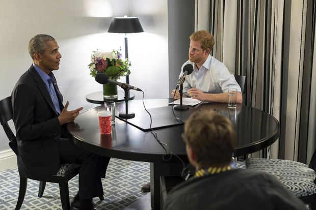 In this undated photo issued on Sunday Dec. 17, 2017 by Kensington Palace courtesy of the Obama Foundation, Britain's Prince Harry, right, interviews former US President Barack Obama as part of his guest editorship of BBC Radio 4's Today programme which is to be broadcast on the December 27, 2017. The interview was recorded in Toronto in September 2017 during the Invictus Games. (Kensington Palace courtesy of The Obama Foundation via AP) ORG XMIT: LON811