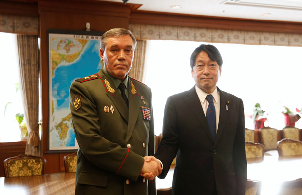 General Valery Gerasimov (L), Chief of the General Staff of the Armed Forces of Russia, shakes hands with Japan's Defense Minister Itsunori Onodera during their meeting at the Defense Ministry in Tokyo, Japan December 11, 2017. REUTERS/Toru Hanai ORG XMIT: GGGTOK511