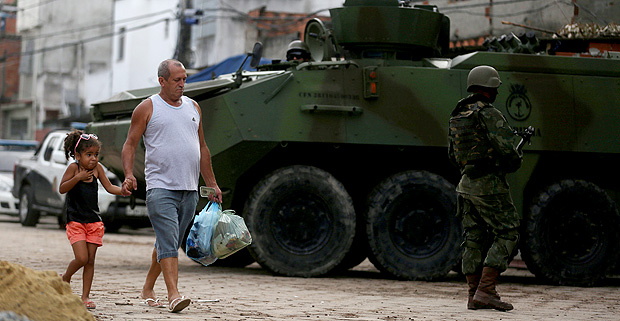 Members of the armed forces patrol the Kelson's slum during an operation against crime in Rio de Janeiro