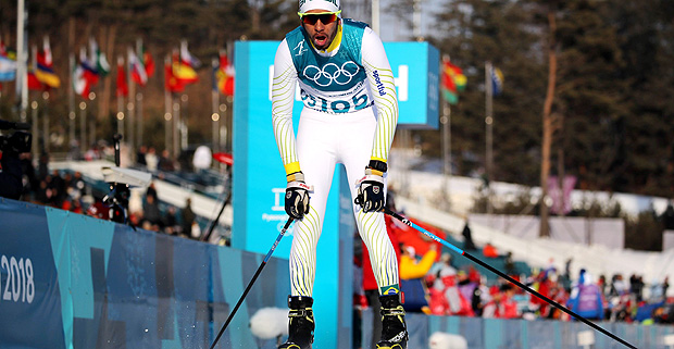Victor Santos of Brazil reacts after crossing the finish line