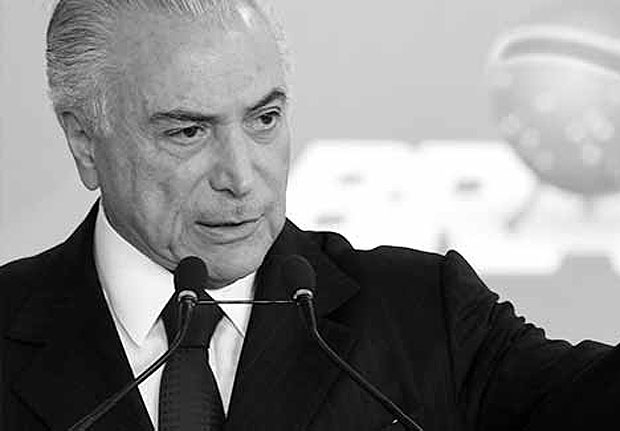 Brazilian President Michel Temer speaks during the signing ceremony of the decree that frees differential prices for payment in cash and with credit card at the Planalto Palace in Brasilia, on June 26, 2017. Temer faces his own crisis with the prosecutor general expected to request formal corruption charges against the president Monday or Tuesday. / AFP PHOTO / EVARISTO SA ORG XMIT: ESA361