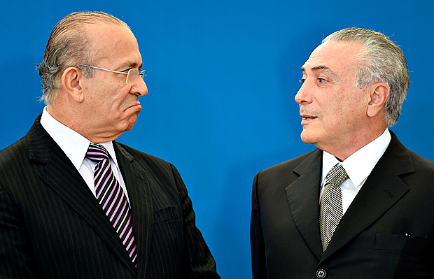 Brazilian acting President Michel Temer (R) talks to his Chief of Staff Eliseu Padilha during the inauguration celemony of the presidents of three Brazilian public banks and Petrobras at Planalto Palace in Brasilia, on June 1, 2016. / AFP PHOTO / EVARISTO SA ORG XMIT: ESA1185