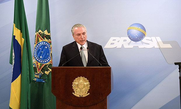 Brazil's President Michel Temer speaks during a press conference following allegations that he gave his blessing to payment of hush money to a politician convicted of corruption, on May 18, 2017 in Brasilia. Temer faced growing pressure to resign Thursday after the Supreme Court gave its green light to the investigation over allegations that he authorized paying hush money to already jailed Eduardo Cunha, the disgraced former speaker of the lower house of Congress. / AFP PHOTO / EVARISTO SA ORG XMIT: ESA105