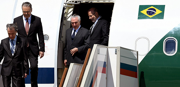 Brazilian President Michel Temer (C) gets off the plane upon his arrival at Moscow's Vnukovo Airport 