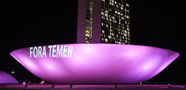 View of a projection reading "Temer Out", referring to Brazilian President Michel Temer, on the Lower House's building during a demo in Brasilia