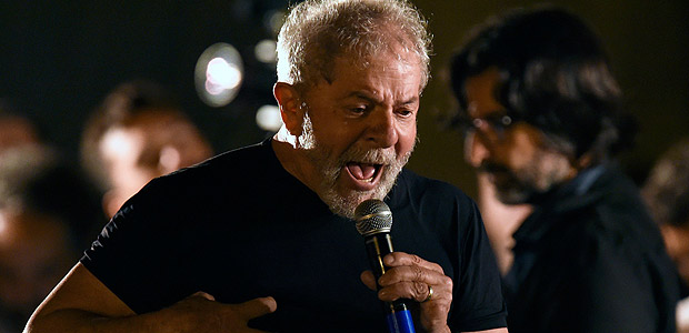 Former Brazilian President Luiz Inacio Lula da Silva addresses supporters during his visit to Station Square, in Belo Horizonte, as part of his 