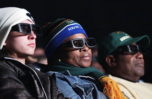 Visitors watch a 3D soccer game in Johannesburg, South Africa, Wednesday, June, 16, 2010. South Africa is playing in group A of the Soccer World Cup. (AP Photo/Darko Bandic) 