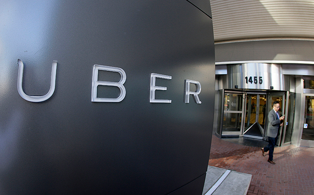 FILE - In this Dec. 16, 2014, file photo a man leaves the headquarters of Uber in San Francisco. Uber picked up a hefty fare Wednesday, July 15, 2015, when a judge fined the taxi-alternative company $7.3 million for refusing to give California regulators information about its business practices, including accident details and how accessible vehicles are to disabled riders. (AP Photo/Eric Risberg, File) ORG XMIT: LA105