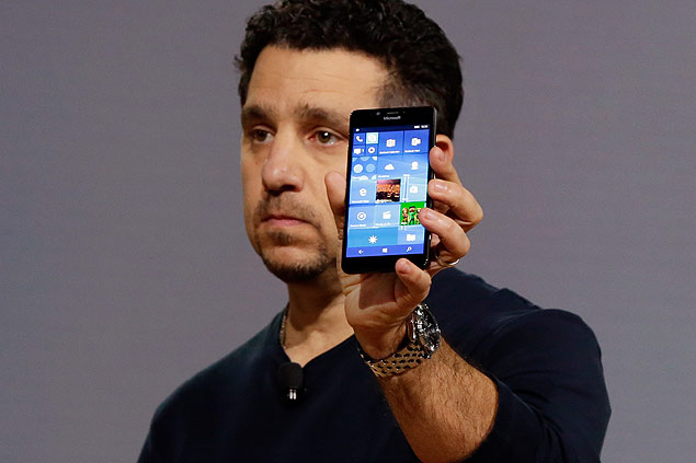 Microsoft vice president for Surface Computing Panos Panay shows a new Lumia 950 phone during a presentation, in New York, Tuesday, Oct. 6, 2015. The device will work with an optional dock. Users can attach a regular monitor, keyboard and mouse and work with apps on the phone just like you would on a Windows 10 desktop. (AP Photo/Richard Drew) ORG XMIT: NYRD103