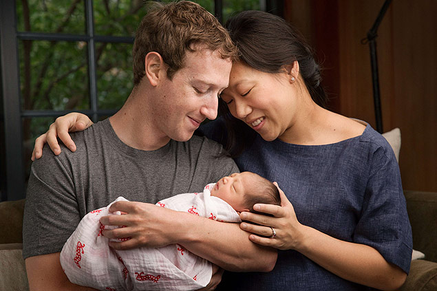 This image obtained December 1, 2015 courtesy of Facebook CEO Mark Zuckerberg shows Mark with his wife Priscilla with their new daughter Max. Facebook co-founder Mark Zuckerberg on December 1 announced he had become a father -- and pledged to give away his fortune to make the world a "better place" for baby daughter Max and others. In a letter to Max posted on his Facebook page, Zuckerberg and his wife said they were going to give away 99 percent of their company shares -- with an estimated value of $45 billion -- in an effort to make a happy and healthy world for her and all children. AFP PHOTO / COUTESY OF MARK ZUCKERBERG ==NO SALES == == RESTRICTED TO EDITORIAL USE / MANDATORY CREDIT: "AFP PHOTO / HANDOUT / COURTESY OF MARK ZUCKERBERG"/ NO MARKETING / NO ADVERTISING CAMPAIGNS / DISTRIBUTED AS A SERVICE TO CLIENTS == ORG XMIT: FBZ001