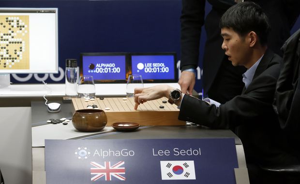  South Korean professional Go player Lee Sedol reviews the match himself after finishing the second match of the Google DeepMind Challenge Match against Google's artificial intelligence program, AlphaGo in Seoul, South Korea, Thursday, March 10, 2016. The human Go champion said he was left "speechless" after his second straight loss to Google's Go-playing machine on Thursday in a highly-anticipated human versus machine face-off. (AP Photo/Lee Jin-man) ORG XMIT: LJM112