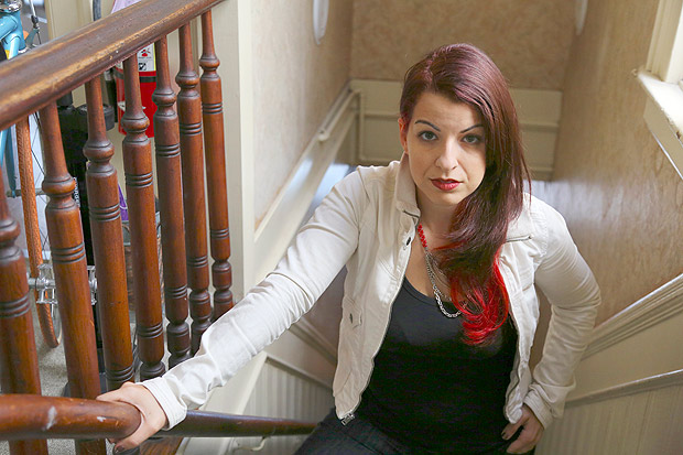 Anita Sarkeesian, a feminist critic whose dissection of how women are portrayed in video games made her a target of harassment and worse, in San Francisco, Oct. 15, 2014. Sarkeesian canceled a speech at Utah State University after an anonymous e-mail threatened a massacre and campus police said they could not legally bar attendees from bringing concealed firearms to the event. (Jim Wilson/The New York Times) - XNYT131