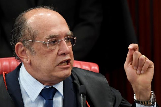 Supreme Electoral Court (TSE) President Gilmar Mendes speaks during the session examining whether the 2014 reelection of president Dilma Rousseff and her then vice president Michel Temer should be invalidated because of corrupt campaign funding, in Brasilia, on June 9, 2017. The lead judge looking into corruption during Brazil's 2014 presidential election voted Friday to strip President Michel Temer of his mandate, but the overall result remained unclear, with six judges yet to weigh in