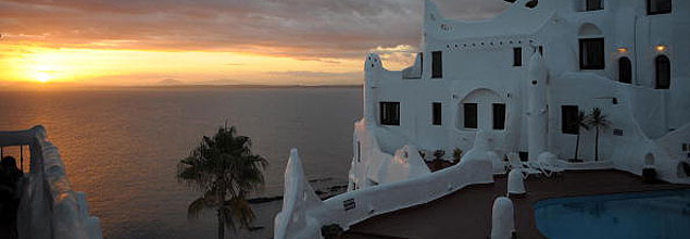 The sun sets right across the signature house-museum of Uruguayan artist Carlos Paez, the tourist symbol of Punta del Este 