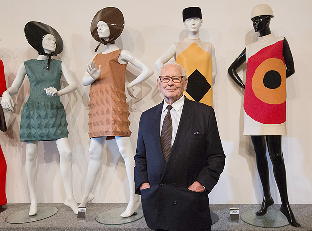 French fashion designer Pierre Cardin poses with dresses behind during the inauguration of the Pierre Cardin Museum in Paris, France, on Thursday, Nov. 13, 2014. Cardin is an Italian-born French fashion designer, known for his avant-garde style and his Space Age designs. (AP Photo/Jacques Brinon) ORG XMIT: XJB117