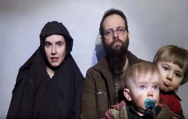 FILE PHOTO: A still image from a video posted by the Taliban on social media on December 19, 2016 shows American Caitlan Coleman (L) speaking next to her Canadian husband Joshua Boyle and their two sons. Courtesy Taliban/Social media via REUTERS ATTENTION EDITORS - THIS IMAGE HAS BEEN SUPPLIED BY A THIRD PARTY. ORG XMIT: TOR353R