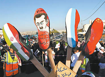 Na Jordnia, srios se preparam para queimar sapatos com as bandeiras do Ir, Rssia e China e a imagem do ditador Assad