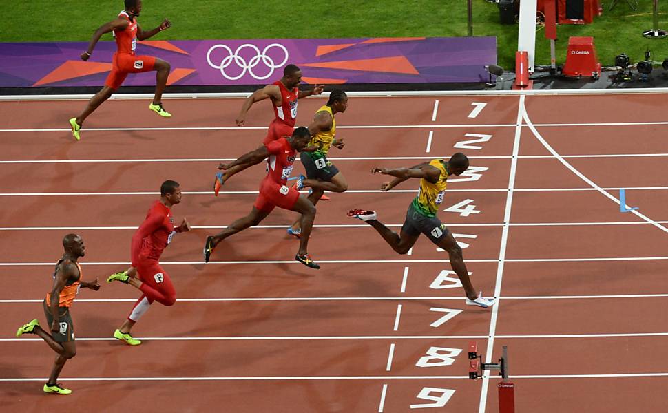 O jamaicano Usain Bolt vence os 100 m com 9s63 seguido pelo compatriota Yohan Blake (9s75) e pelo americano Justin Gatlin (9s79) Veja a evolução da prova nos últimos 100 anos em infográfico exclusivo