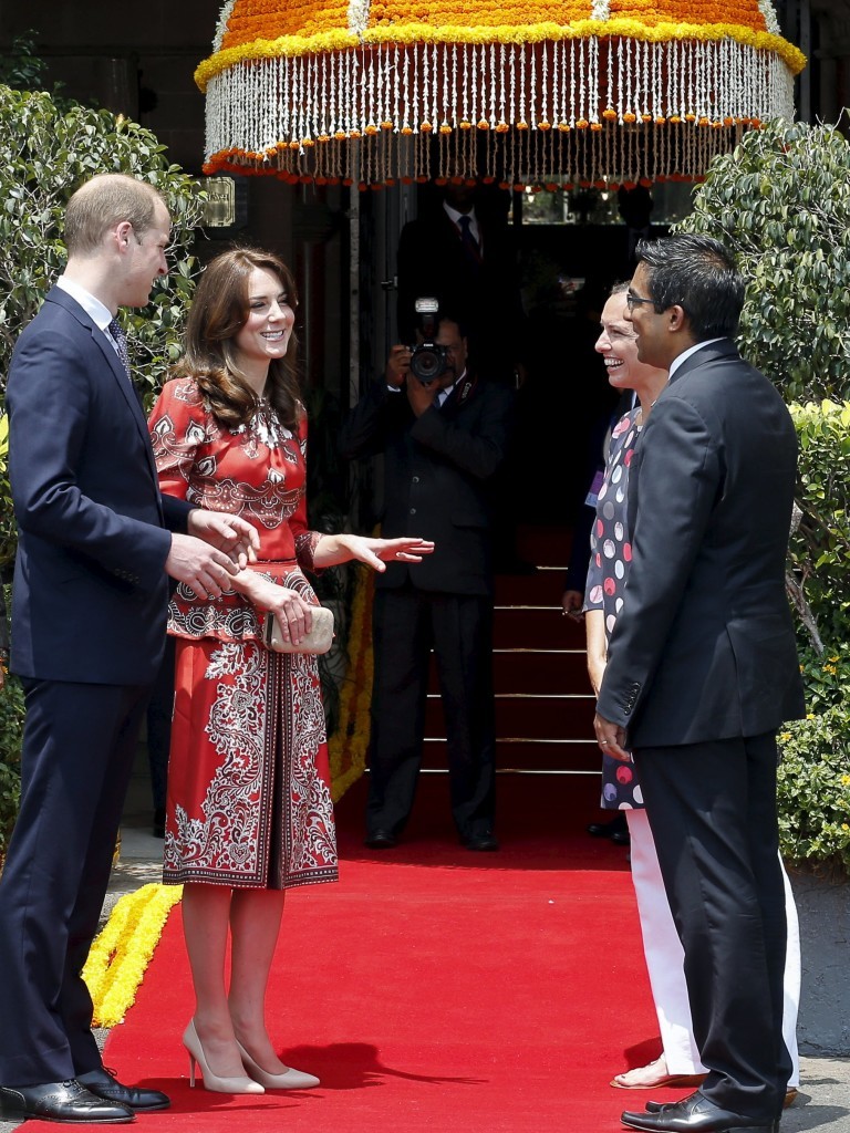 Britain's Prince William and his wife Catherine, Duchess of Cambridge, speak to the hotel staff after arriving at the Taj Mahal Palace hotel in Mumbai