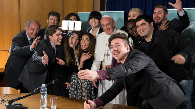 Pope Francis poses for a selfie picture during a meeting of the Scholas Occurrentes at the Vatican