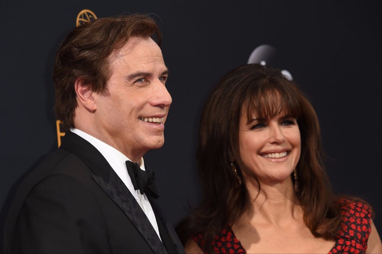 Outstanding Supporting Actor in a Limited Series or Movie "People v. O.J. Simpson" nominee John Travolta (L), and Kelly Preston arrive for the 68th Emmy Awards on September 18, 2016 at the Microsoft T