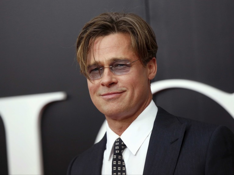 Cast member Brad Pitt poses on the red carpet at the premiere of "The Big Short" in New York