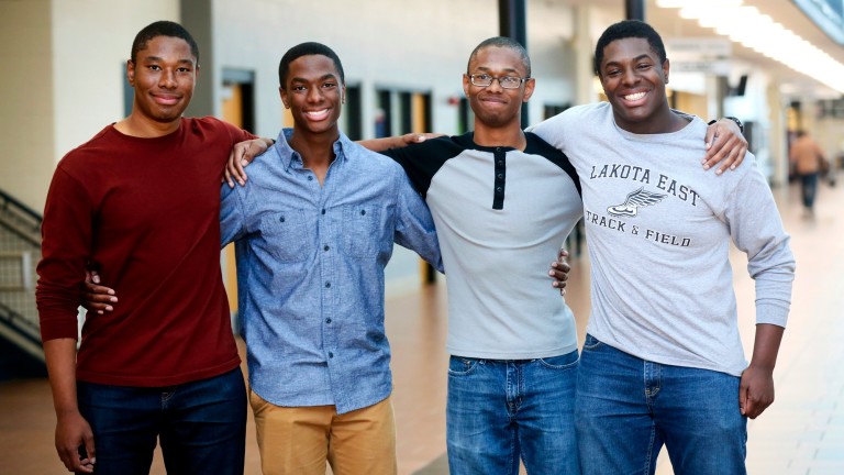 Lakota East seniors and quadruplet brothers from left, Zachary, Aaron, Nigel, and Nick Wade pose together at Lakota East High School, in Liberty Township, Ohio, Wednesday, April 5, 2017. All the broth