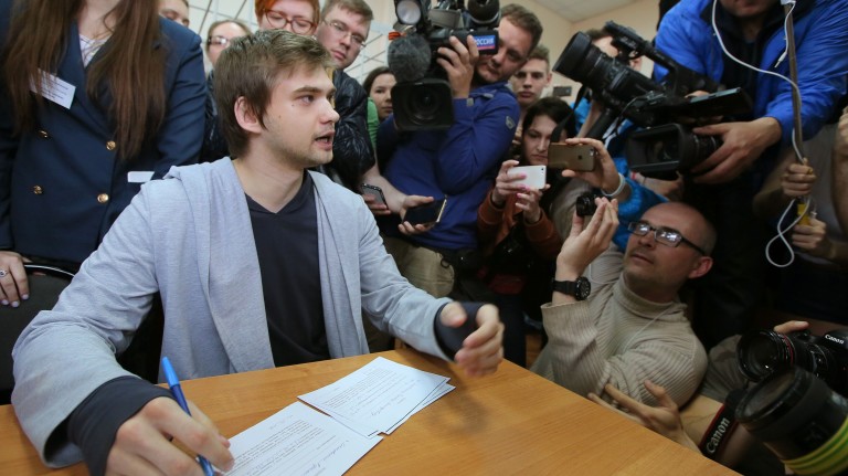 Ruslan Sokolovsky (L), a blogger who played Pokemon Go on his phone in a church, speaks to the press during a hearing at a court in Yekaterinburg on May 11, 2017.  A Russian court on May 11 convicted 