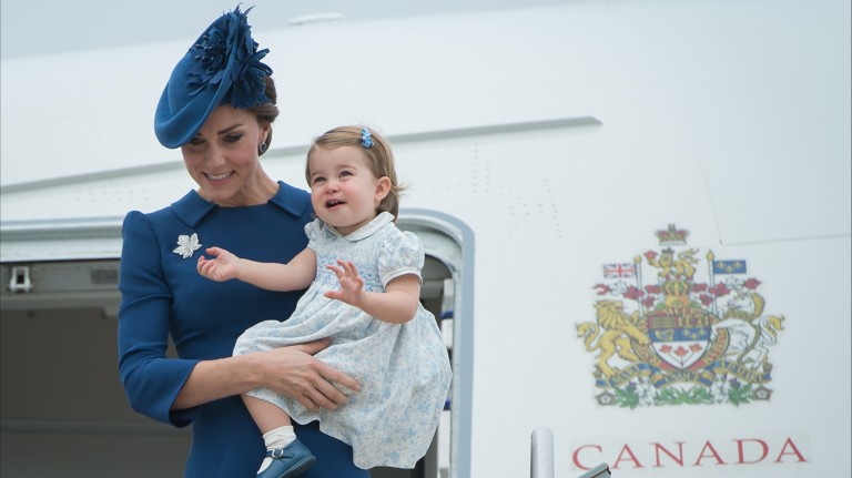 Kate Middleton, The Duchess of Cambridge holds her daughter Princess Charlotte as the family arrives in Victoria, British Columbia, Saturday Sept. 24, 2016. (Jonathan Hayward/The Canadian Press via AP