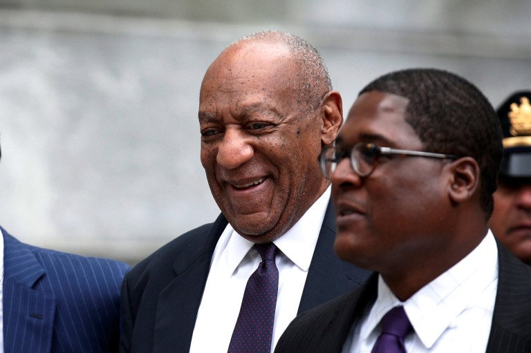 Actor and comedian Bill Cosby leaves with his spokesman Andrew Wyatt after the second day of his sexual assault trial at the Montgomery County Courthouse