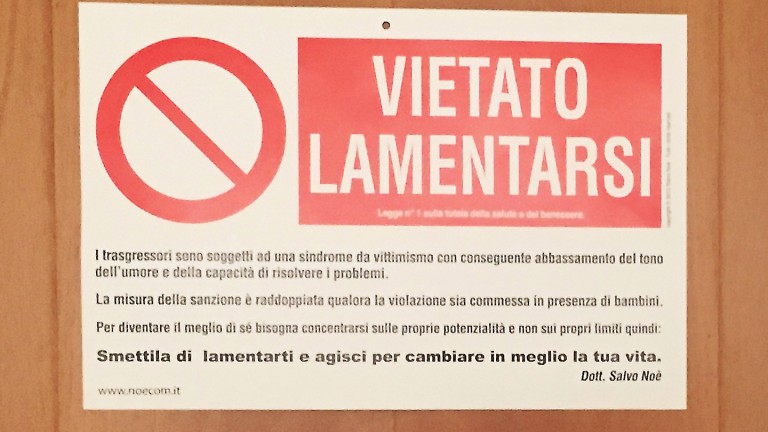 This photograph released by The Vatican Insider - La Stampa newspaper, shows the banner reading " Forbidden to Complain " on the door of the private apartment of Pope Francis at The Vatican on July 12