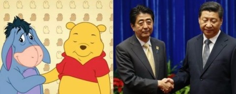 Aperto de mão estranho entre Abe (esquerda) e Jinping foi comparado ao de Bisonho e Pooh
