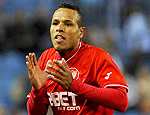 Atacante comemora gol pelo Sevilla (Jorge Guerrero- 5.jan.2011/AFP)