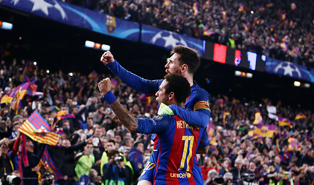 Barcelona's Lionel Messi celebrates with Neymar their victory during the Champion League round of 16, second leg soccer match against Paris Saint Germain at the Camp Nou stadium in Barcelona, Spain, Wednesday March 8, 2017. (AP Photo/Emilio Morenatti) ORG XMIT: EM103