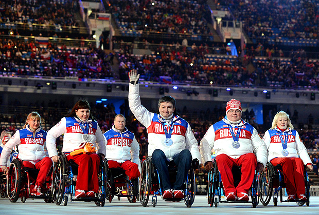 (FILES) This file photo taken on March 16, 2014 shows Russia's delegation attending the Closing Ceremony of the XI Paralympic Olympic games at the Fisht Olympic Stadium near the city of Sochi.Russia's team will be suspended from the Paralympic Winter Games in Pyeongchang, but individual athletes will be allowed to compete under a neutral flag, the International Paralympics Committee in Bonn, western Germany, said Monday on January 29, 2018. / AFP PHOTO / KIRILL KUDRYAVTSEV ORG XMIT: KUD2697