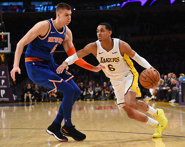 Jan 21, 2018; Los Angeles, CA, USA; New York Knicks forward Kristaps Porzingis (6) defends Los Angeles Lakers guard Jordan Clarkson (6) in the second half at Staples Center. Mandatory Credit: Jayne Kamin-Oncea-USA TODAY Sports ORG XMIT: USATSI-362903