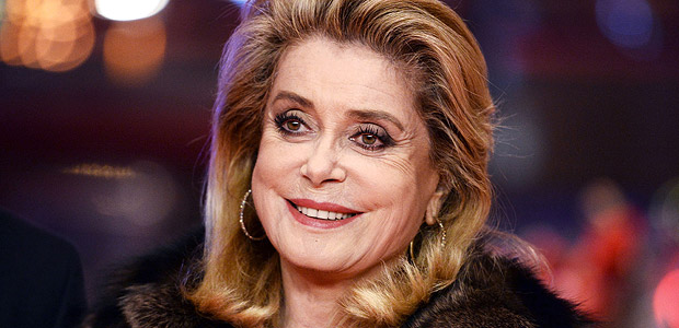 (FILES) This file photo taken on February 14, 2017 shows French actress Catherine Deneuve posing on the red carpet for the premiere of the film "Sage Femme" (The Midwife) in competition at the 67th Berlinale film festival in Berlin. France's most revered actress Catherine Deneuve hit out on January 9, 2018 at a new "puritanism" sparked by sexual harassment scandals, declaring that men should be "free to hit on" women. / AFP PHOTO / dpa / Gregor Fischer / Germany OUT ORG XMIT: 90-027247
