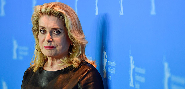 (FILES) This file photo taken on February 14, 2017 shows French actress Catherine Deneuve posing for photographers during a photocall for the film "Sage Femme" (The Midwife) in competition at the 67th Berlinale film festival in Berlin. Feminists and one of the women who accused fallen Hollywood mogul Harvey Weinstein of rape turned on French actress Catherine Deneuve on January 10, 2018 after she signed an open letter attacking the #MeToo movement for leading a witch-hunt against men. / AFP PHOTO / John MACDOUGALL
