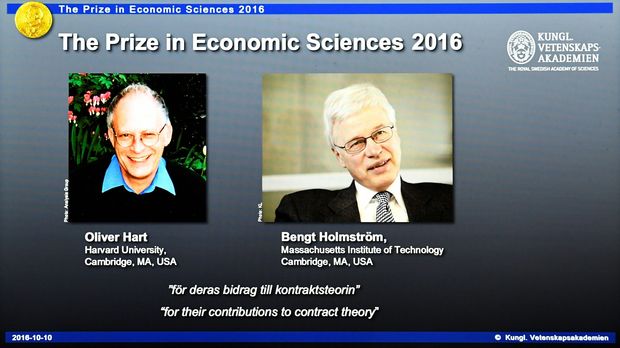 Winners of the Nobel Prize in Economic Sciences British-American economist Oliver Hart (L) and Bengt Holmstrom of Finland are displayed on a screen during a press conference to announce the winner of the 2016 Nobel Prize in Economic Sciences at the Royal Swedish Academy of Sciences in Stockholm on October 10, 2016. Hart and Holmstrom won the Prize for their work on contract theory, the jury said. / AFP PHOTO / JONATHAN NACKSTRAND