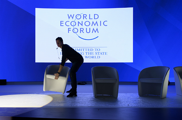 A worker is busy with final preparations inside the Congress Center two days ahead of the 47th Annual Meeting of the World Economic Forum, WEF, in Davos, Switzerland, on Sunday, Jan.15, 2017. (Gian Ehrenzeller/Keystone via AP) ORG XMIT: MDAV102